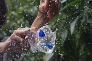 Photograph of a water balloon popping using a fast shutter speed